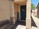 Cozy front porch with a welcome sign, bench, and a charming floral wreath on the front door at 9052 Pine Mission Ave, Las Vegas, NV 89143