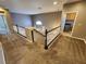 Upstairs hallway with carpet and white banister overlooking the staircase at 9052 Pine Mission Ave, Las Vegas, NV 89143