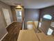 Second story hallway looking down into the entry and open-concept living space at 9052 Pine Mission Ave, Las Vegas, NV 89143