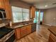 Kitchen featuring double basin sink, wooden cabinetry, and stainless steel appliances at 9052 Pine Mission Ave, Las Vegas, NV 89143