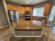 Kitchen featuring stainless steel appliances, central island, and countertops at 9052 Pine Mission Ave, Las Vegas, NV 89143