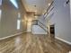 Open floor plan with wood-look floors, two story ceilings and a staircase at 9052 Pine Mission Ave, Las Vegas, NV 89143