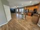 Spacious living room with hard wood floors connecting to kitchen with stainless appliances at 9052 Pine Mission Ave, Las Vegas, NV 89143