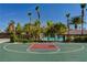 Well-kept basketball court with resort-style amenities including a pool and waterpark in the background at 907 Gallery Course Dr, Las Vegas, NV 89148