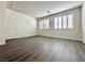 Bedroom boasts wood-look flooring and window shutters at 907 Gallery Course Dr, Las Vegas, NV 89148