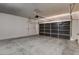 Spacious two car garage with roll up door and concrete floors at 907 Gallery Course Dr, Las Vegas, NV 89148
