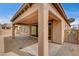 Relaxing backyard patio featuring brick, columns, and sliding glass doors to indoors at 907 Gallery Course Dr, Las Vegas, NV 89148