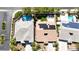 An aerial view showcasing neighborhood homes with solar panels and backyard swimming pools at 9155 Harvest Homes St, Las Vegas, NV 89123