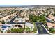 A picturesque aerial shot displays a residential neighborhood with lovely homes and mature trees at 9155 Harvest Homes St, Las Vegas, NV 89123
