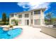 Beautiful backyard features a sparkling pool, patio space, and lush landscaping, perfect for outdoor entertaining at 9155 Harvest Homes St, Las Vegas, NV 89123