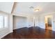 Spacious bedroom with hardwood floors, walk-in closet, neutral walls, and bright, natural light at 9155 Harvest Homes St, Las Vegas, NV 89123