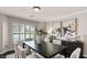 Sophisticated dining room with plantation shutters, stylish artwork, and neutral colors at 9155 Harvest Homes St, Las Vegas, NV 89123