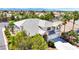 Well-manicured two-story home with a lush landscaped yard and three-car garage in a gated community at 9155 Harvest Homes St, Las Vegas, NV 89123