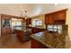 Gorgeous kitchen featuring custom cabinets, granite countertops, a wine fridge, and stainless appliances at 9155 Harvest Homes St, Las Vegas, NV 89123