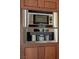Close-up of built-in stainless steel microwave and a coffee maker at 9155 Harvest Homes St, Las Vegas, NV 89123