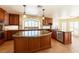 Gourmet kitchen with custom cabinets, stone backsplash, stainless steel appliances, and granite counters at 9155 Harvest Homes St, Las Vegas, NV 89123