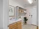 Laundry room with basin and wooden cabinet at 9155 Harvest Homes St, Las Vegas, NV 89123