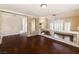 Living room with dark wood floors and clerestory windows at 9155 Harvest Homes St, Las Vegas, NV 89123