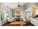 Cozy living room with vaulted ceilings, a fireplace, and hardwood floors at 9155 Harvest Homes St, Las Vegas, NV 89123