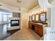 Spacious bathroom with double vanity, soaking tub, and fireplace between the bedroom and bathroom at 9155 Harvest Homes St, Las Vegas, NV 89123