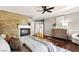 This main bedroom features a fireplace, dark floors, and French doors at 9155 Harvest Homes St, Las Vegas, NV 89123