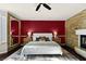 The main bedroom features a decorative stone wall, and a white fireplace at 9155 Harvest Homes St, Las Vegas, NV 89123