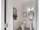 Powder room with pedestal sink and artistic nook at 9155 Harvest Homes St, Las Vegas, NV 89123