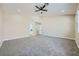 Spacious main bedroom features neutral paint, plush carpet, and an ensuite bathroom at 9272 W Viking Rd, Las Vegas, NV 89147