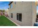 Home exterior showing manicured lawn area and windows at 9715 Aleutian St, Las Vegas, NV 89178