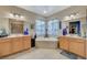 Spacious bathroom features a soaking tub, dual sinks, and bright natural lighting at 9715 Aleutian St, Las Vegas, NV 89178