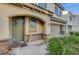 Charming front door with stone accents and a well-maintained landscape enhancing curb appeal at 9715 Aleutian St, Las Vegas, NV 89178