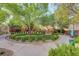 Community greenbelt showcasing a circular garden with benches and walking paths at 9715 Aleutian St, Las Vegas, NV 89178