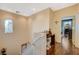 Upstairs hallway with hardwood floors and a view of a secondary bedroom at 9715 Aleutian St, Las Vegas, NV 89178