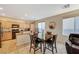 Charming kitchen with granite countertops, wood cabinets, and sleek black appliances at 9715 Aleutian St, Las Vegas, NV 89178