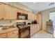 Traditional kitchen featuring stainless steel appliances and light wood cabinetry at 9715 Aleutian St, Las Vegas, NV 89178