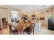 Well-lit kitchen boasts granite counters, stainless steel appliances, and wood cabinetry at 9715 Aleutian St, Las Vegas, NV 89178