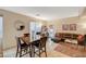 Inviting living and dining space featuring stylish decor and comfortable seating arrangement at 9715 Aleutian St, Las Vegas, NV 89178