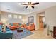 Open-concept living room with comfortable seating and direct access to the kitchen area at 9715 Aleutian St, Las Vegas, NV 89178
