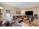 Comfortable living area featuring a plush sectional sofa and a flat screen television at 9715 Aleutian St, Las Vegas, NV 89178