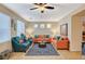 Bright living room with comfortable seating, ceiling fan, and natural light, creating a relaxing atmosphere at 9715 Aleutian St, Las Vegas, NV 89178