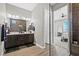 Elegant bathroom with double vanity, hardwood floors, and a glass-enclosed shower for a spa-like retreat at 10186 Zeta Tucana St, Las Vegas, NV 89143