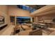Open-concept living space with modern furnishings and access to the outdoor backyard and pool at 120 Still Shores St, Henderson, NV 89011