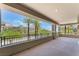 Large open balcony with views of the resort and tall palms at 128 Los Cabos Dr # 202, Las Vegas, NV 89144