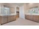 Bright bathroom with double vanities, modern fixtures, and neutral color palette at 128 Los Cabos Dr # 202, Las Vegas, NV 89144