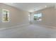 Large bedroom with plush carpet, light walls, and a view at 128 Los Cabos Dr # 202, Las Vegas, NV 89144
