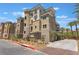 Beautifully landscaped building exterior featuring multiple floors and private balconies at 128 Los Cabos Dr # 202, Las Vegas, NV 89144