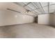 Spacious two car garage, perfect for storage and organization with bright lighting at 128 Los Cabos Dr # 202, Las Vegas, NV 89144