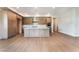 Beautiful kitchen features light wood cabinets, stainless steel appliances and a large center island at 128 Los Cabos Dr # 202, Las Vegas, NV 89144