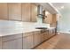 Close up of a kitchen with stainless steel appliances, white subway tile backsplash, and quartz countertops at 128 Los Cabos Dr # 202, Las Vegas, NV 89144