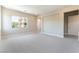 Large bedroom featuring neutral walls and carpet, with an exterior view from the window at 128 Los Cabos Dr # 302, Las Vegas, NV 89144